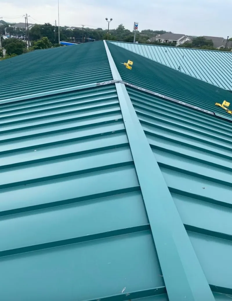 Green commercial metal roof ridge and valley for Metal Roof Repair in Whitney